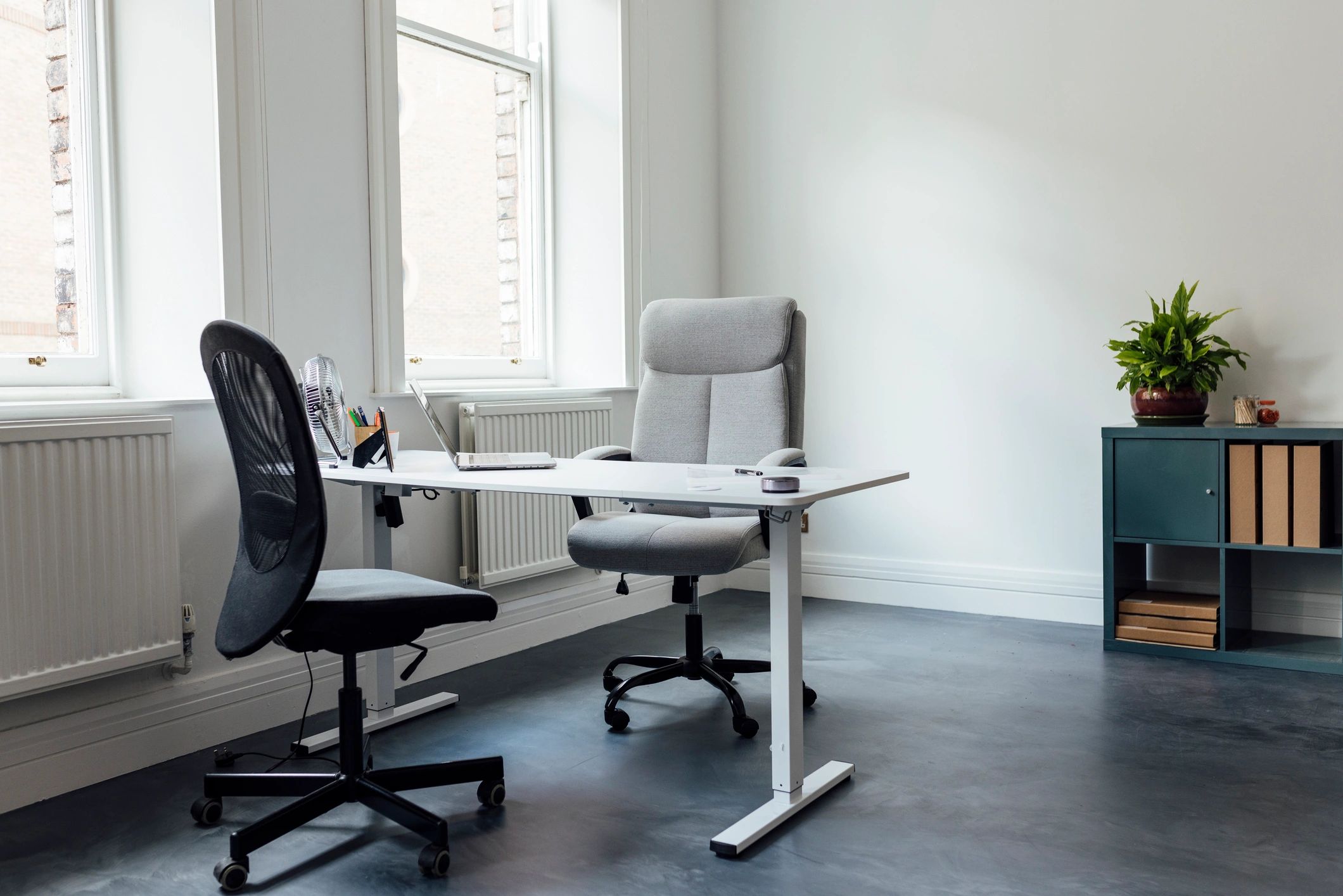 Studio office desk and equipment in a simple workspace