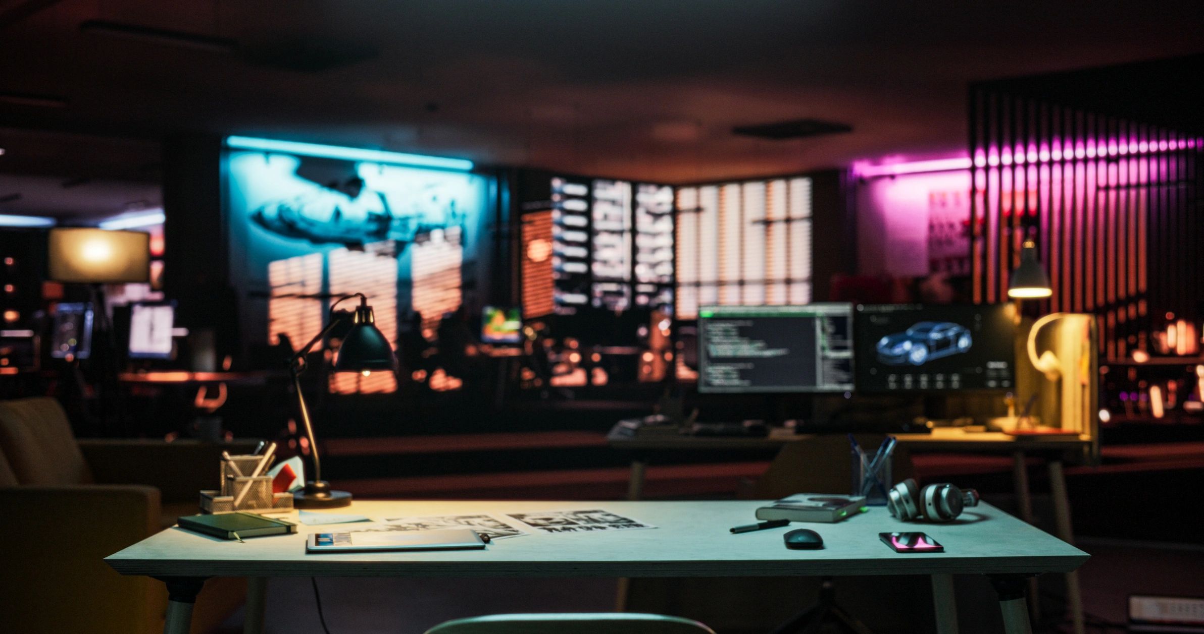 Game development workspace with monitors and creative setup